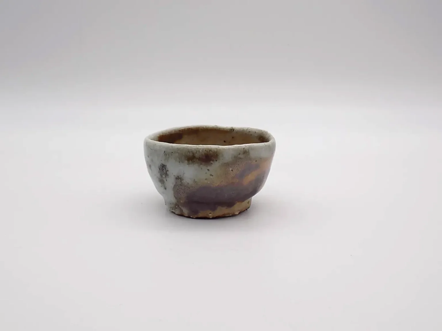 Hand thrown ochoko ash glaze by Timi Lantos Ceramics