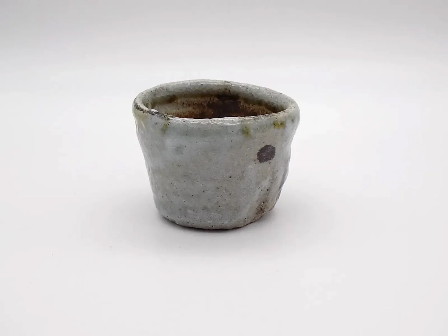 Hand thrown earthy tones ochoko side view by Timi Lantos Ceramics