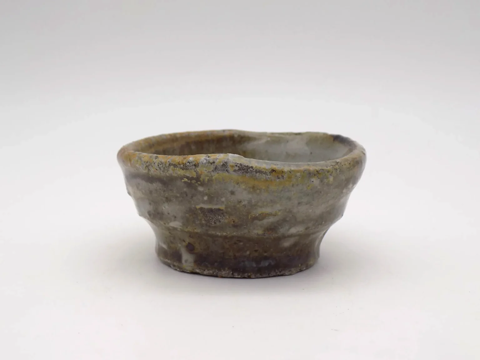 Hand thrown ochoko cup with feldspar glaze by Timi Lantos Ceramics