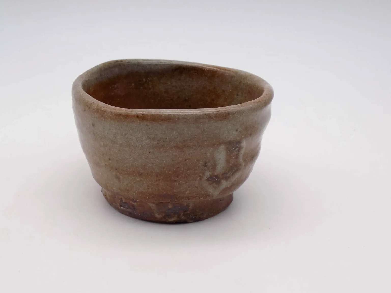 Hand-thrown ochoko with red wave pattern, detail by Timi Lantos Ceramics
