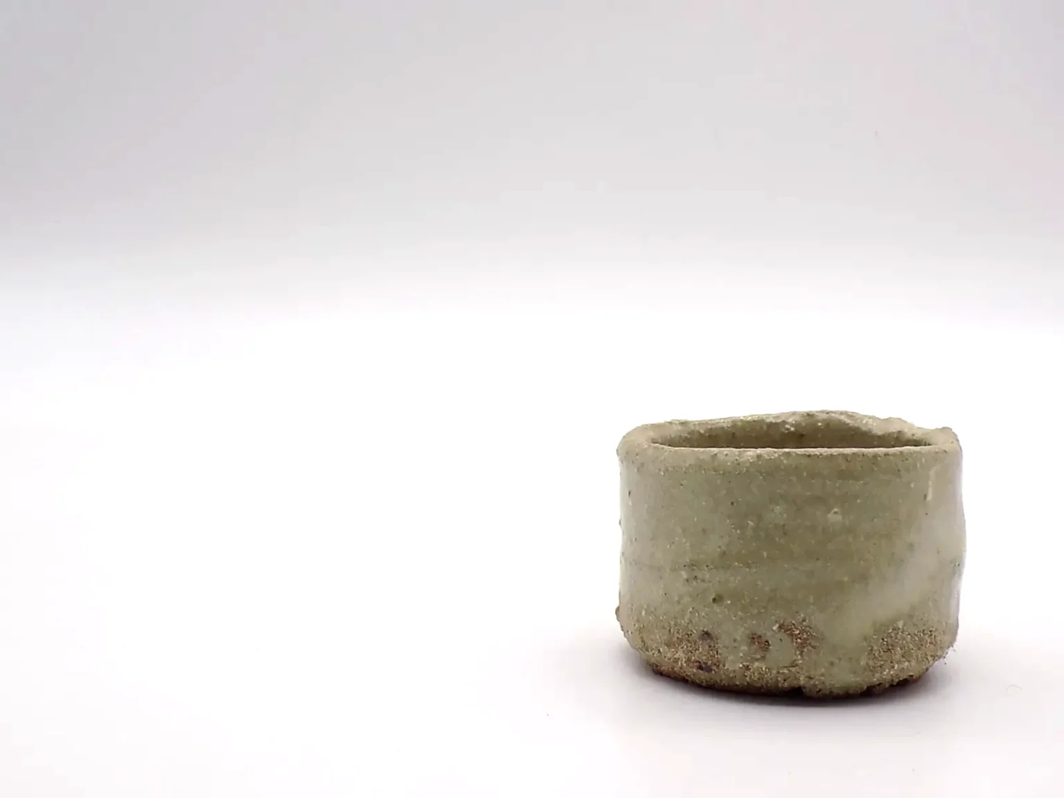 Hand thrown sake cup with ash glaze detail by Timi Lantos Ceramics