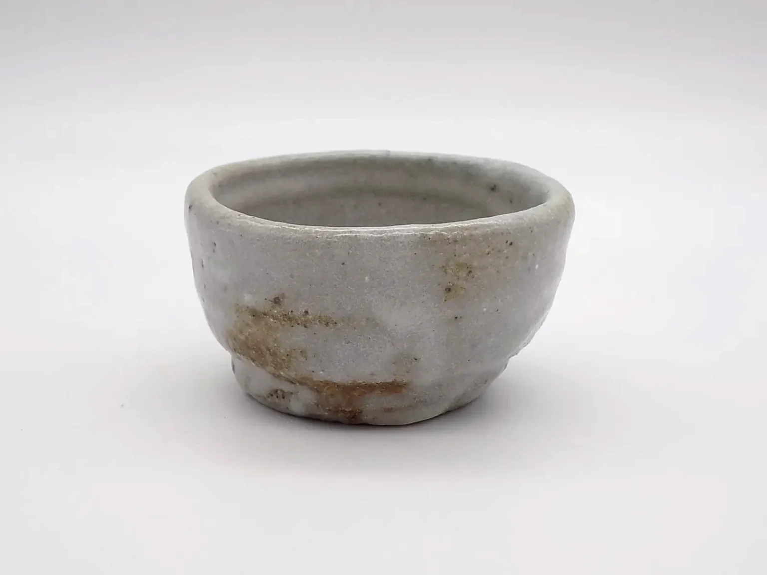 Hand-thrown brown sake cup, detail by Timi Lantos Ceramics