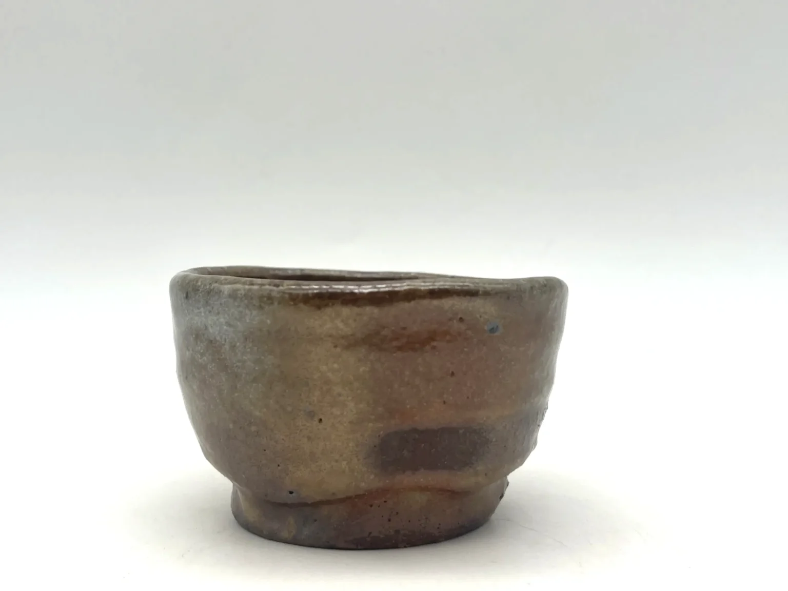 Hand-thrown wabi-sabi sake cup with gradiation, detail by Timi Lantos Ceramics
