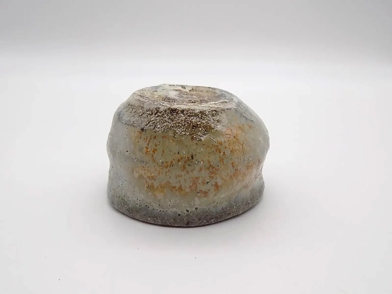 Hand thrown sake cup with rice straw ash glaze by Timi Lantos Ceramics
