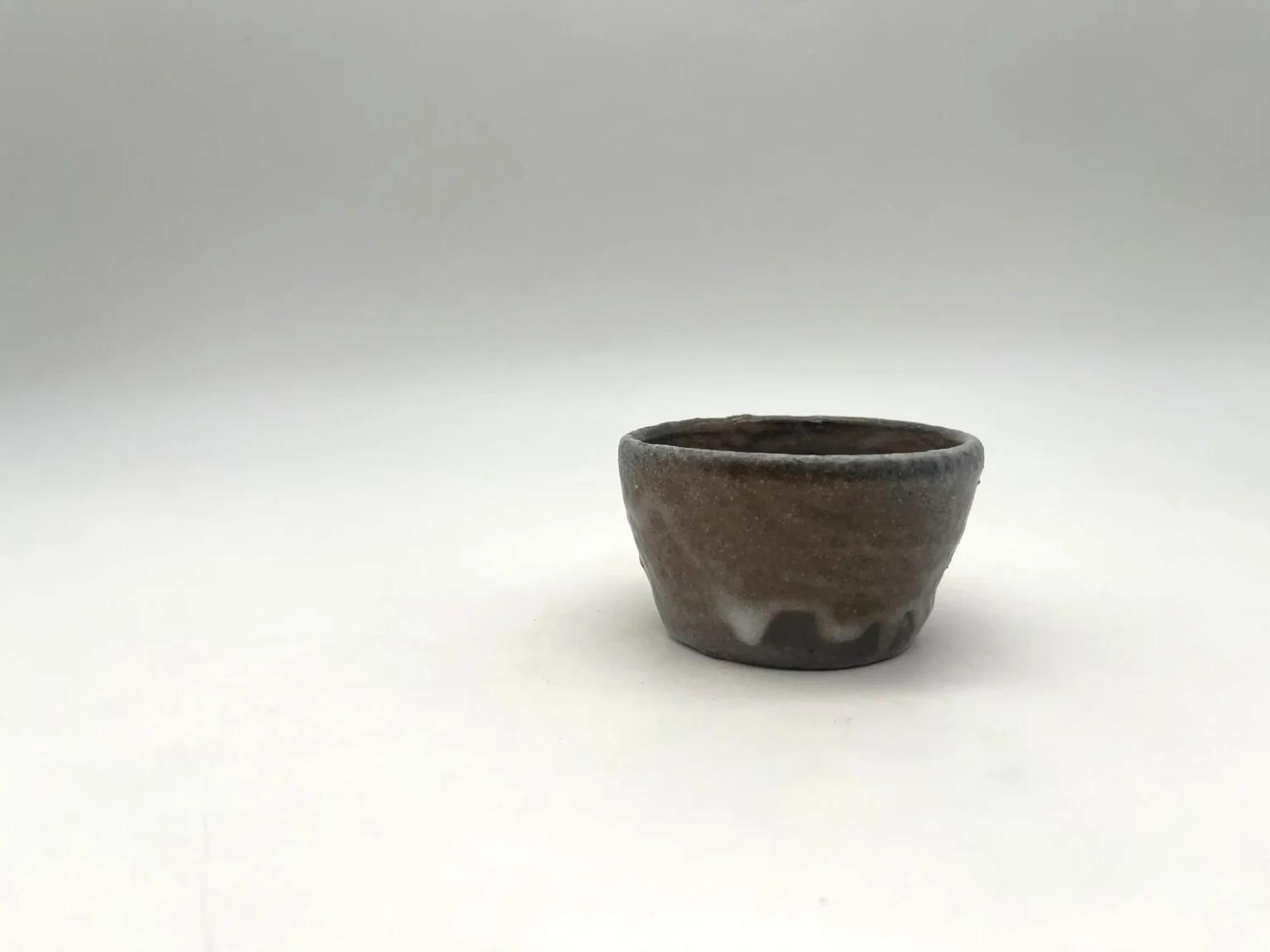 Anagama white ochoko, side view by Timi Lantos Ceramics