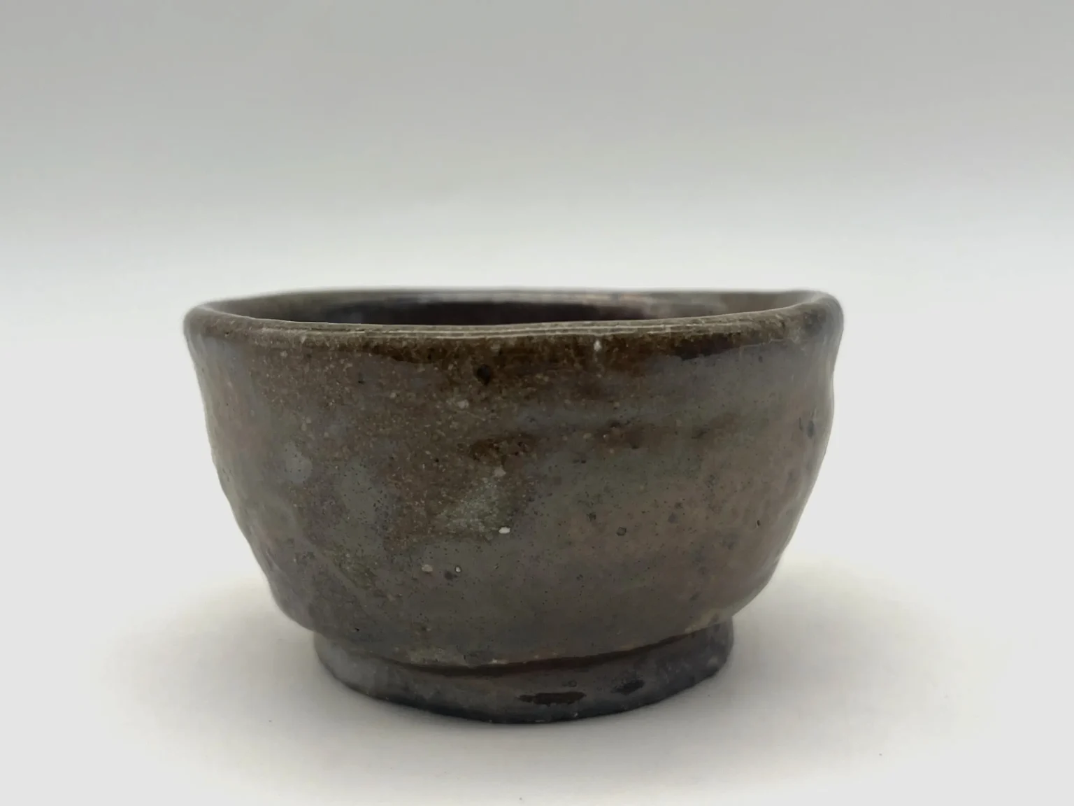 Ochoko with brown ash cover by Timi Lantos Ceramics