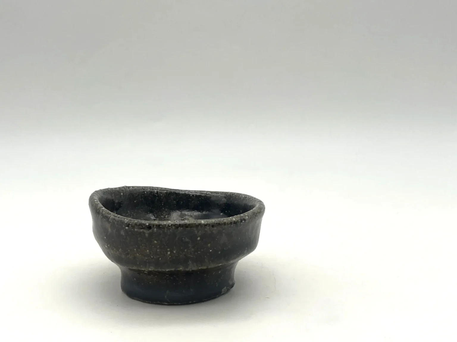 Ochoko with ash glaze and black firecolor effects by Timi Lantos Ceramics