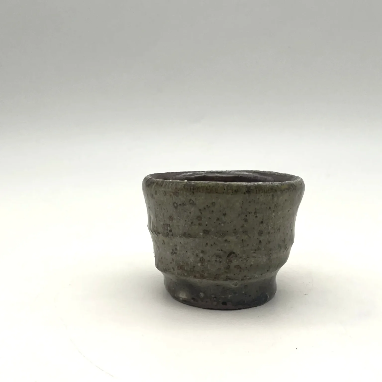 Ochoko with brown speckle glaze, side view by Timi Lantos Ceramics