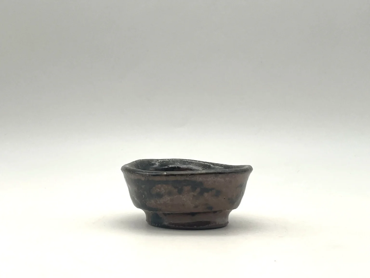 Ochoko with layered earthy tones, side view by Timi Lantos Ceramics