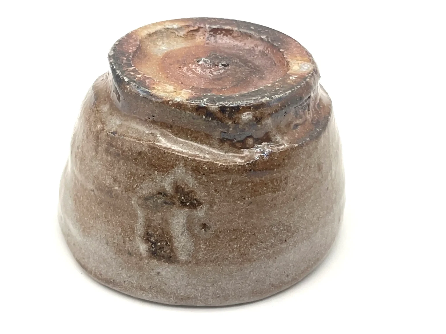 Unique red Shino glaze ochoko, bottom view by Timi Lantos Ceramics
