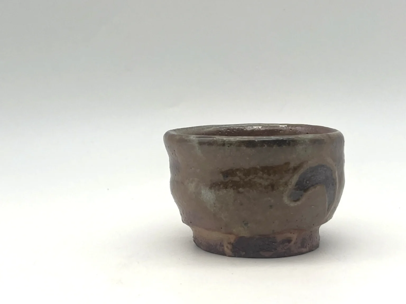 Wabi-sabi ochoko with iron spot markings by Timi Lantos Ceramics