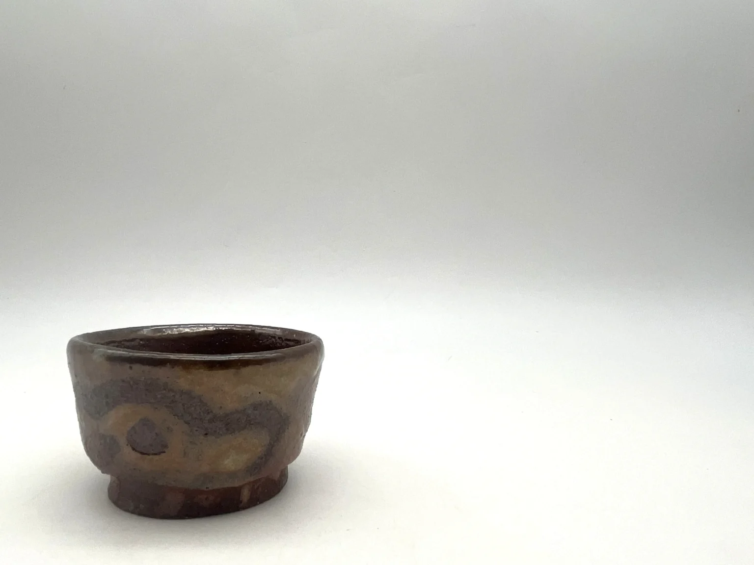 Ochoko with white Shino glaze, side view by Timi Lantos Ceramics