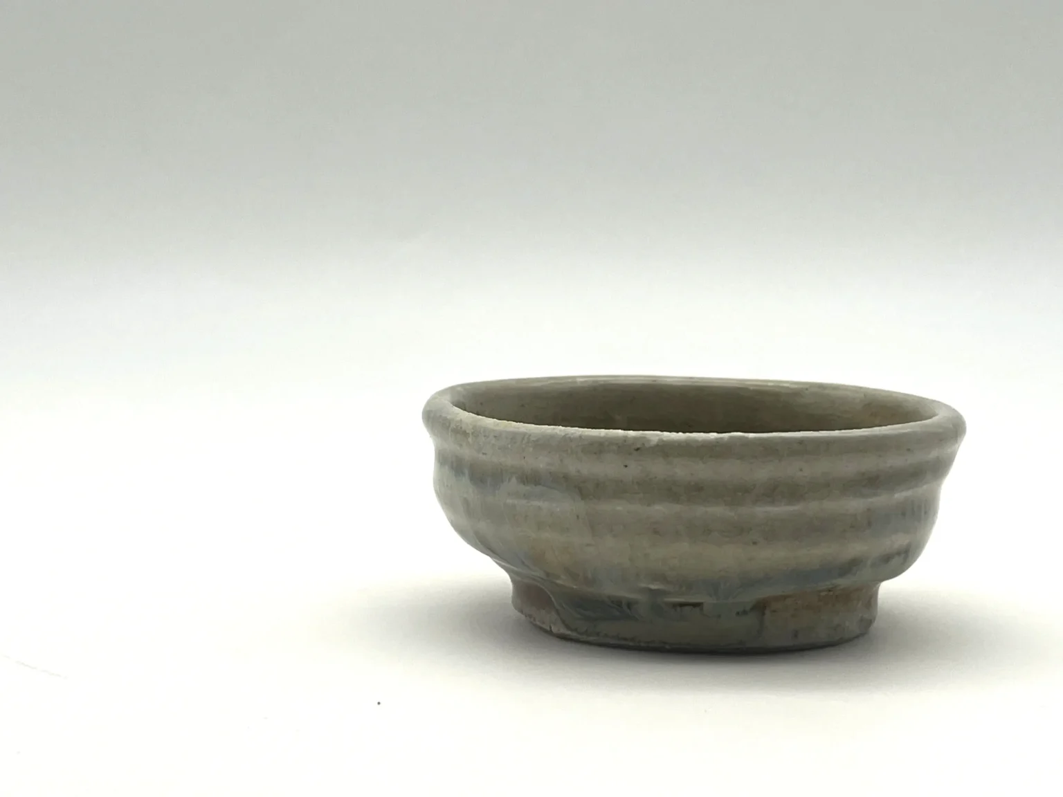 Wood-fired beige ochoko, side view by Timi Lantos Ceramics