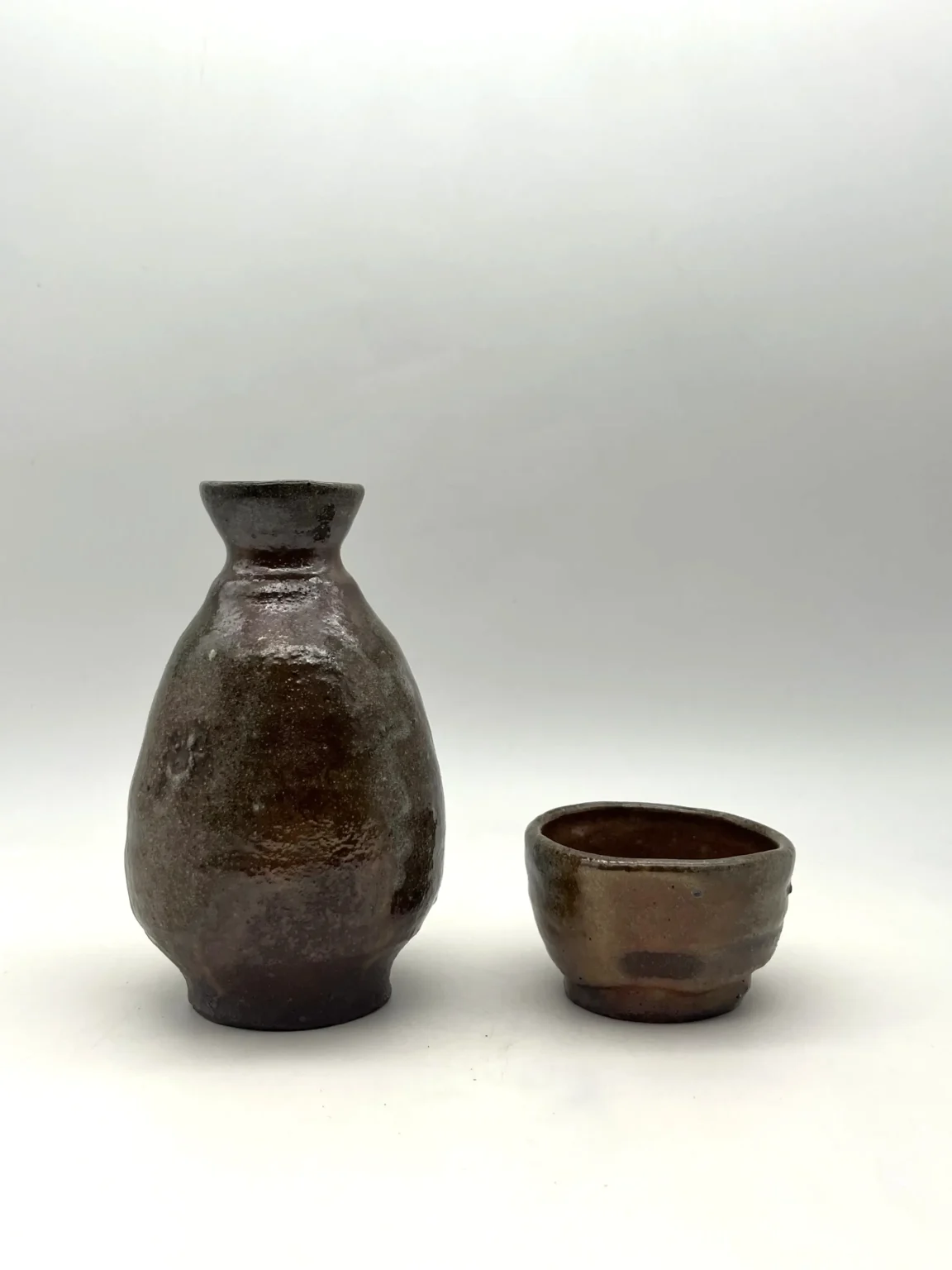 Sake bottle with brown ash cover and carbon trap by Timi Lantos Ceramics