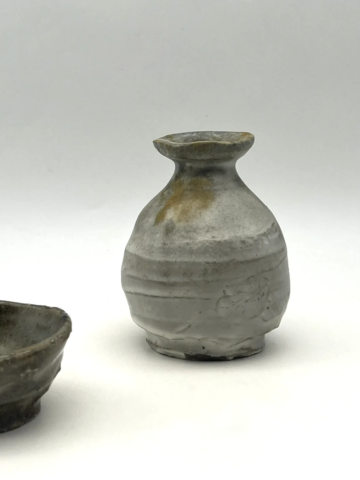 Sake bottle with ash glaze and brown slipware by Timi Lantos Ceramics
