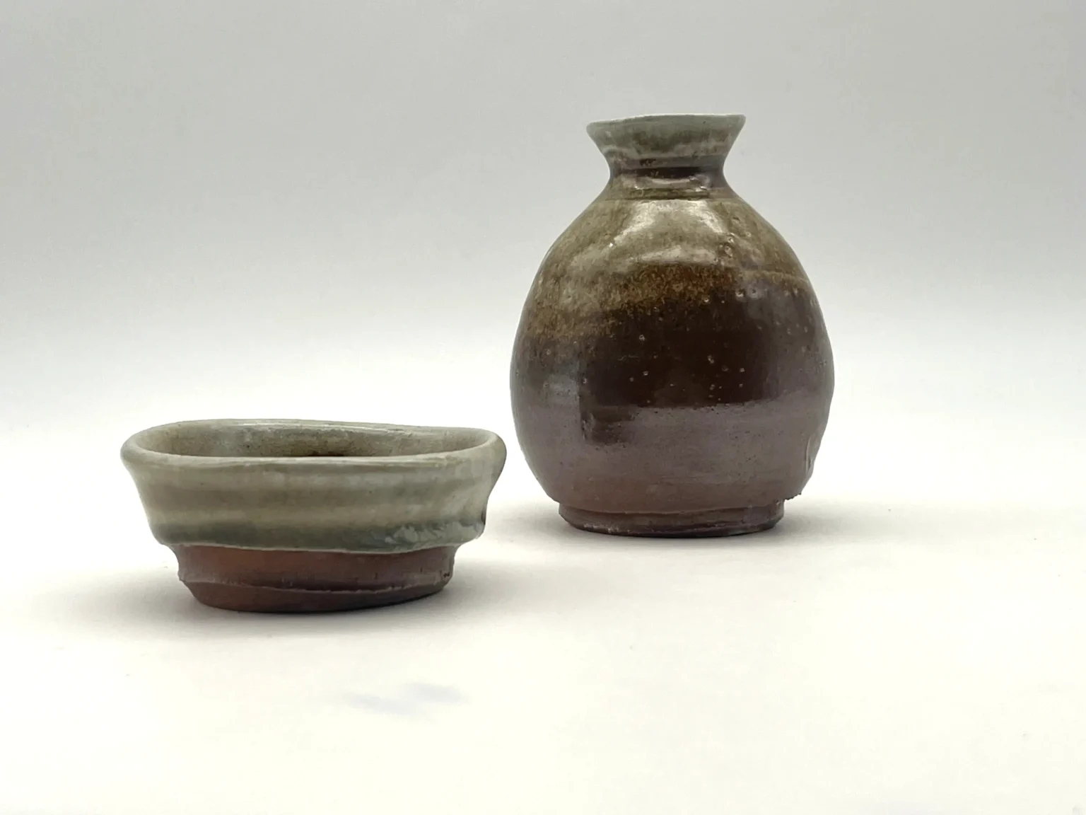 Sake bottle with earthy ash glaze on porcelain by Timi Lantos Ceramics