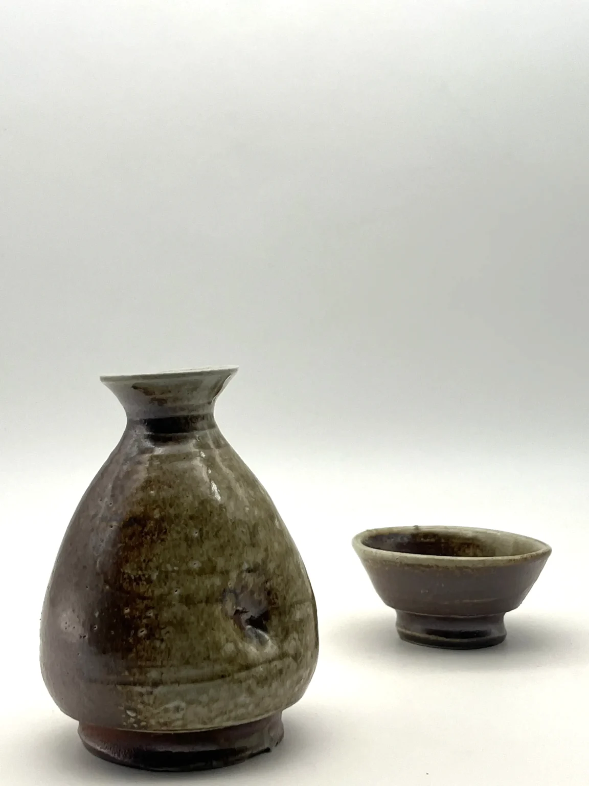 Sake bottle with earthy ash glaze by Timi Lantos Ceramics