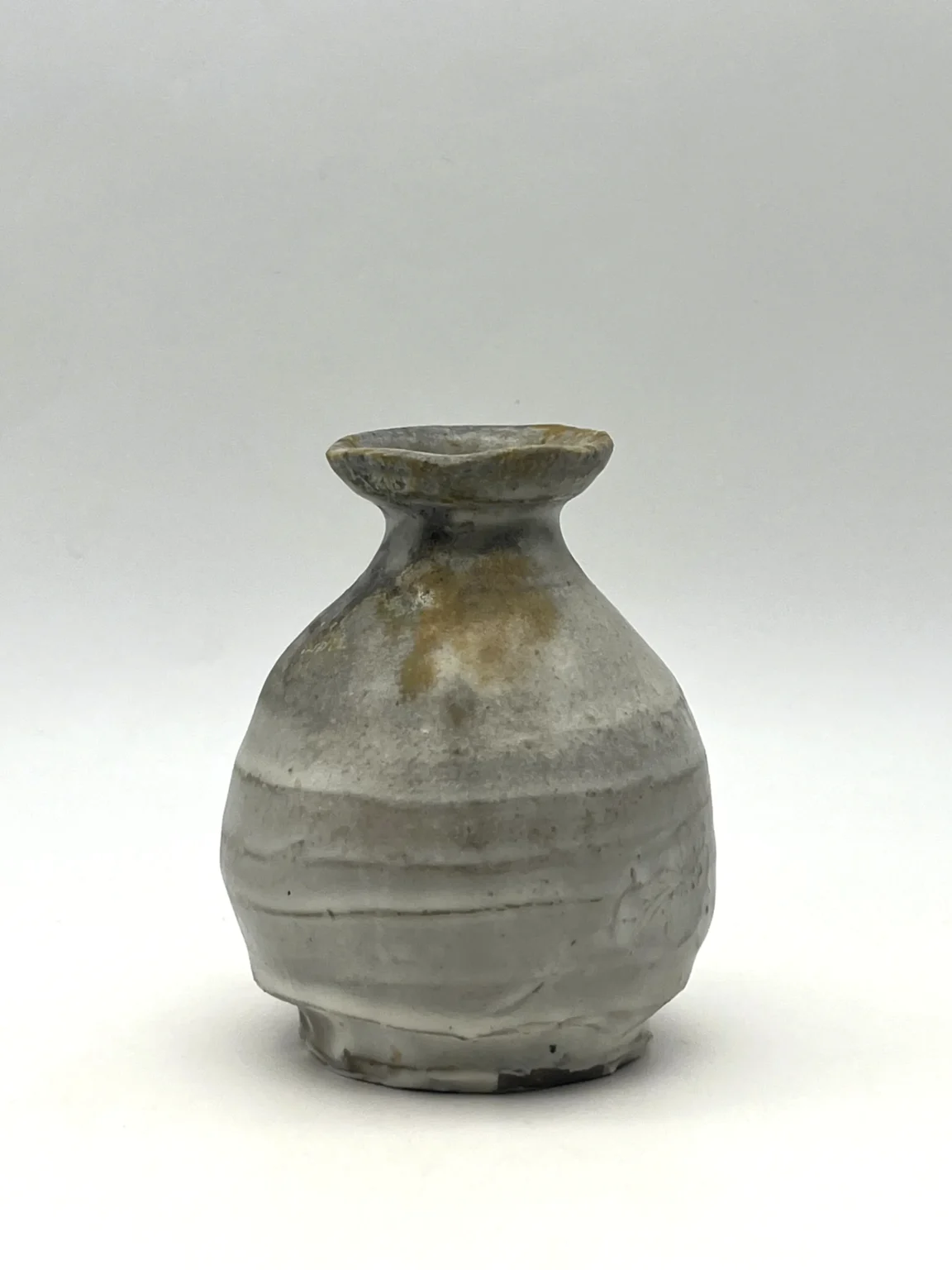 Sake bottle with ash glaze and brown slip by Timi Lantos Ceramics