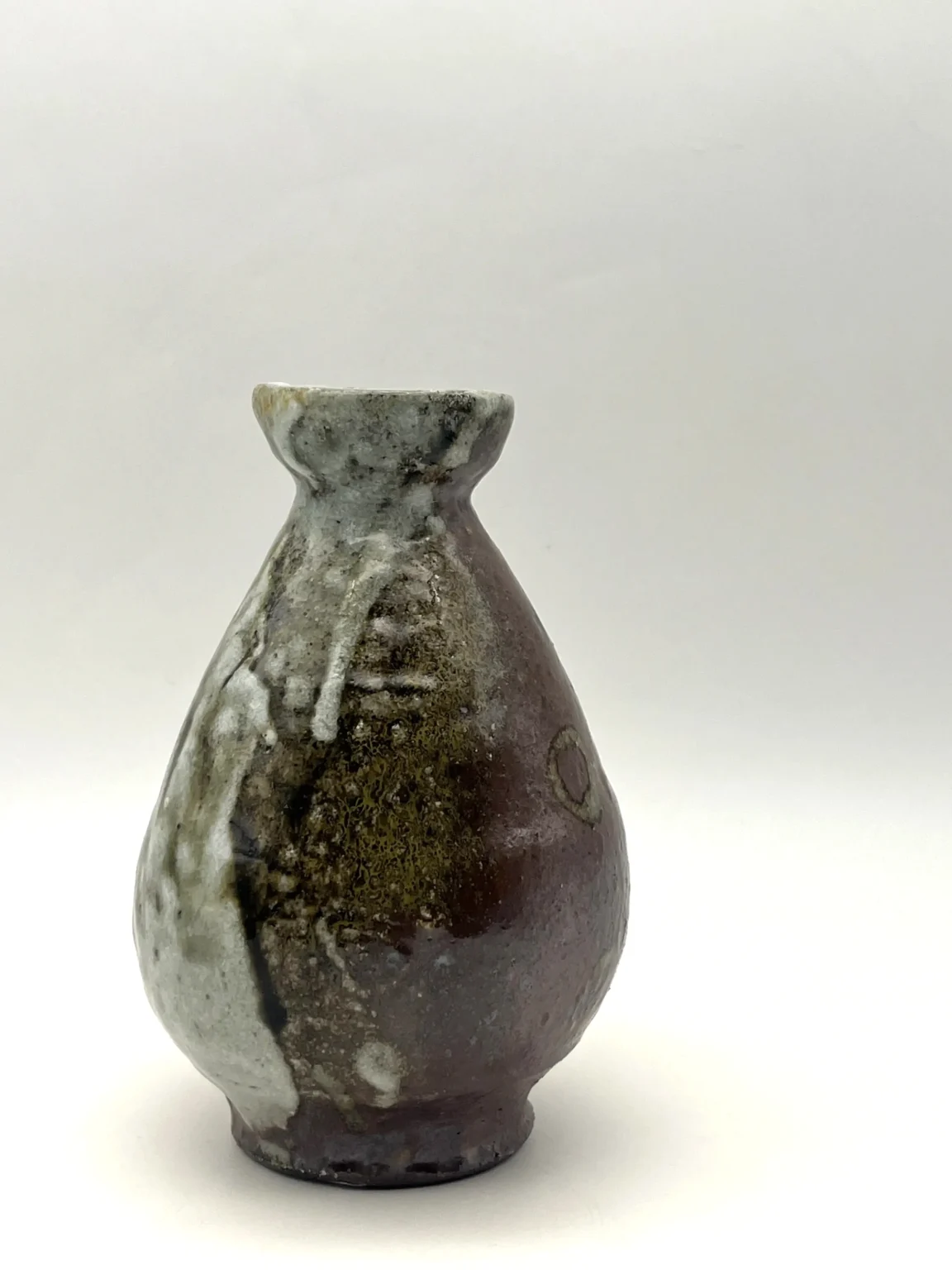 Sake bottle with earthy carbon trap effect by Timi Lantos Ceramics