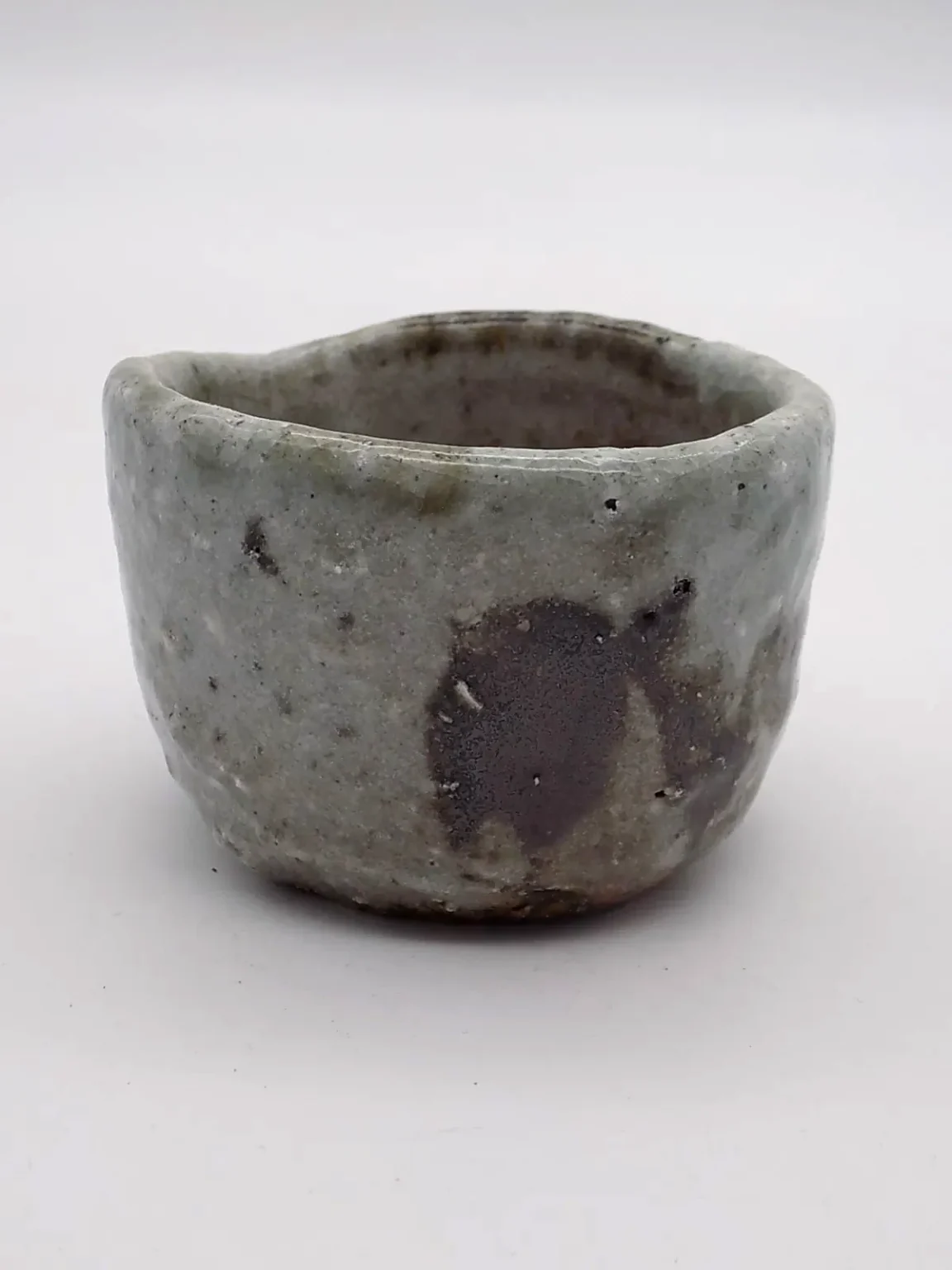 Sake cup with green ash glaze, top view by Timi Lantos Ceramics