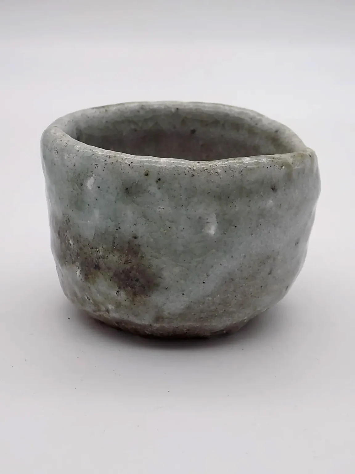 Sake cup with earthy ash glaze, side view by Timi Lantos Ceramics
