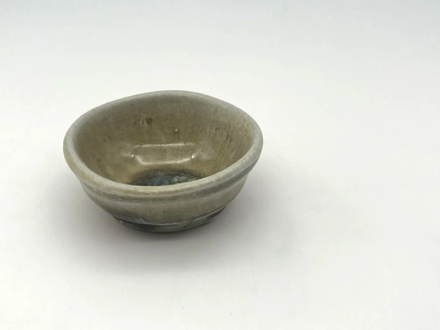 Sake cup with beige glaze, top view by Timi Lantos Ceramics