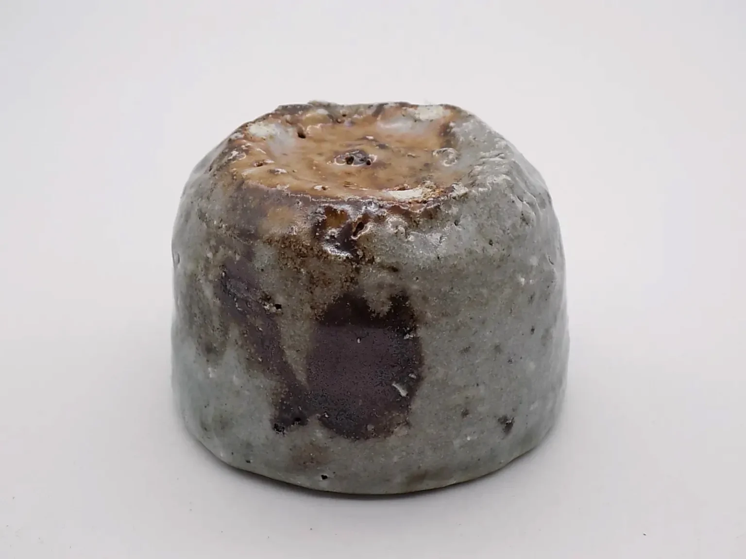 Sake cup with earthy tones, bottom view by Timi Lantos Ceramics