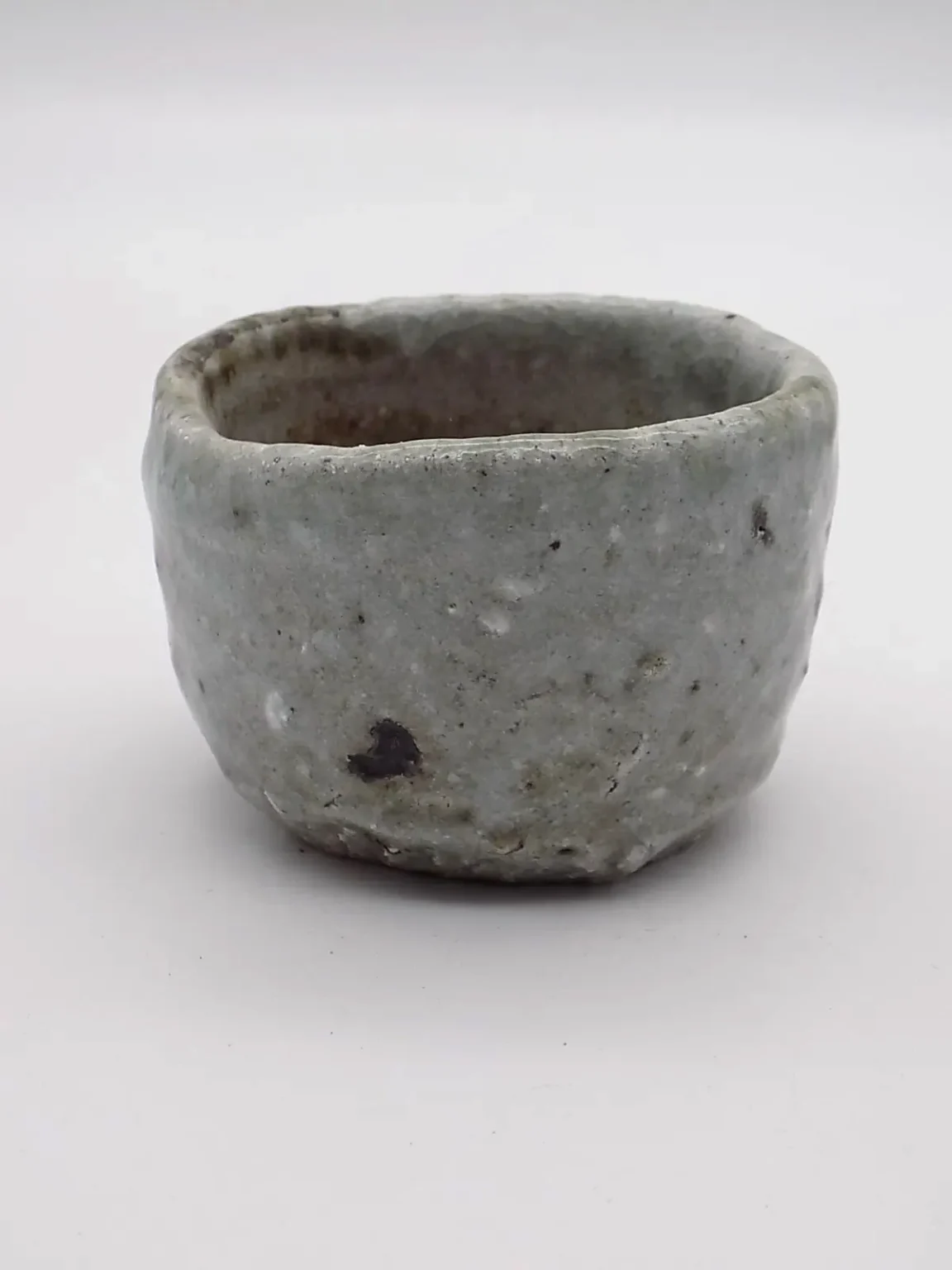 Minimal white sake cup, side view by Timi Lantos Ceramics