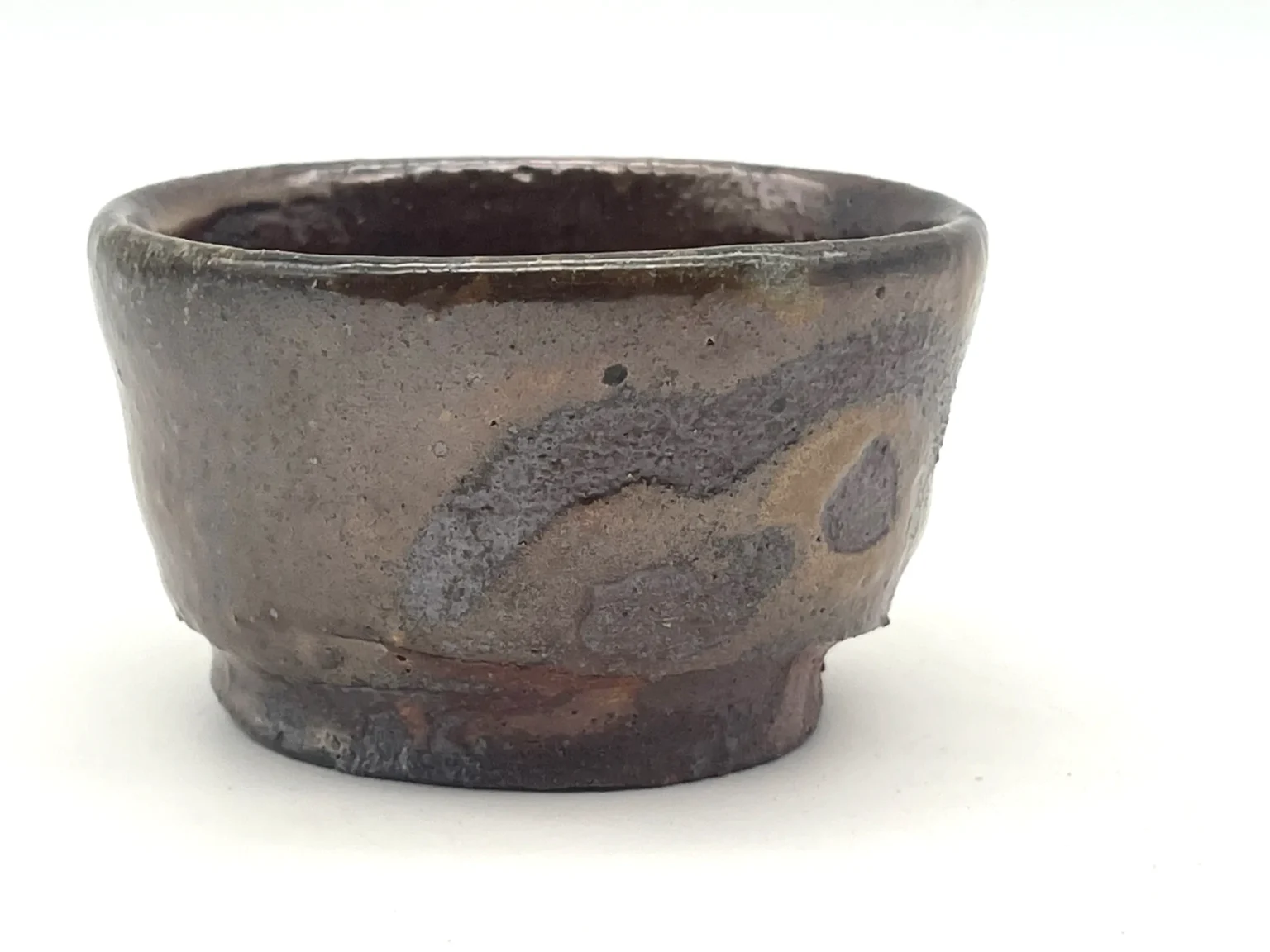 Sake cup with a unique glaze, top view by Timi Lantos Ceramics