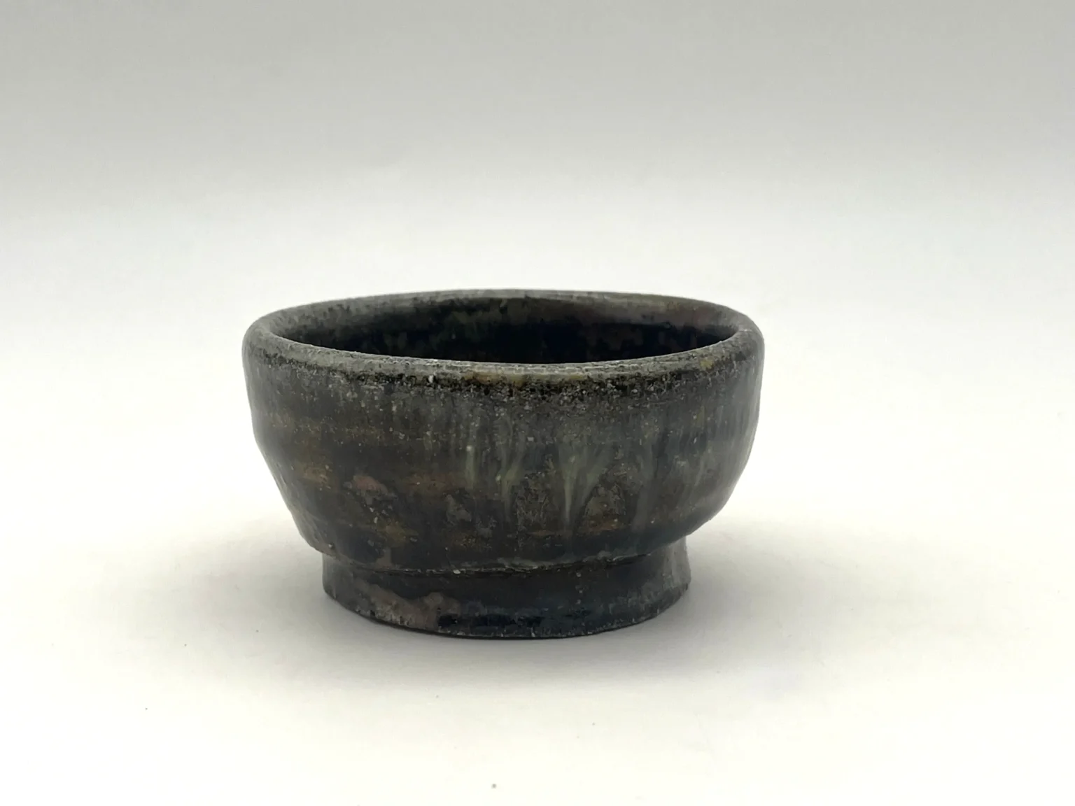 Sake cup with white Shino glaze, side view by Timi Lantos Ceramics