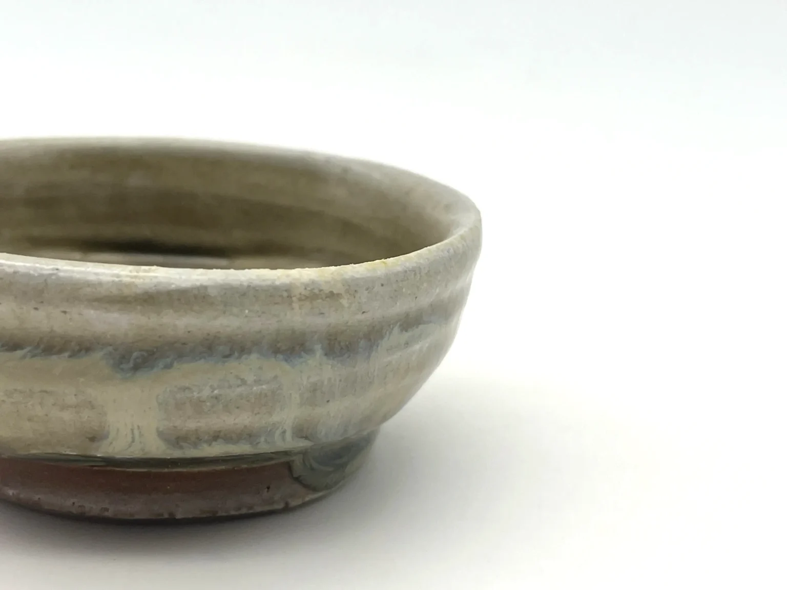 Wood-fired sake cup with ash glaze, top view by Timi Lantos Ceramics