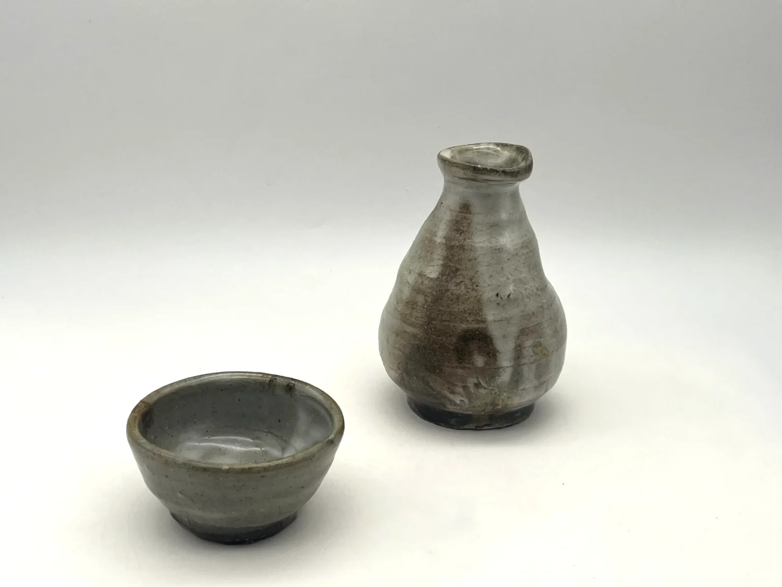 Brown tokkuri sake bottle with ash covered surface by Timi Lantos Ceramics