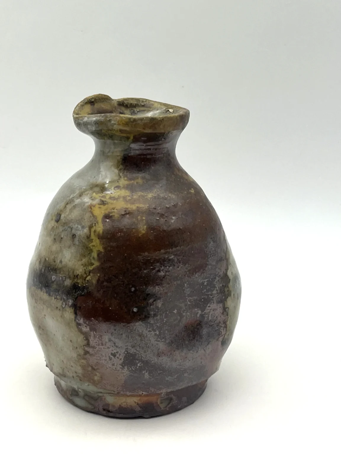 Tokkuri sake bottle with ash glaze and natural flame marks by Timi Lantos Ceramics