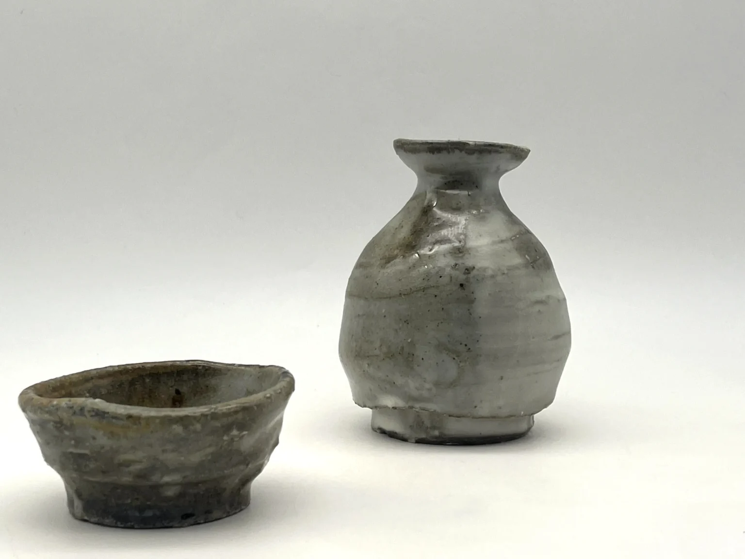 Tokkuri sake bottle with ash cover and natural fire color effects by Timi Lantos Ceramics
