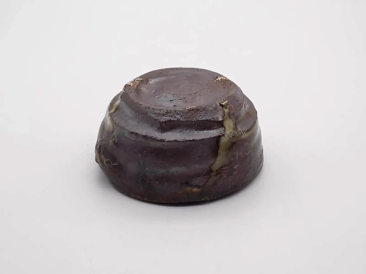 Wheel-thrown ochoko with ash glaze, bottom view by Timi Lantos Ceramics