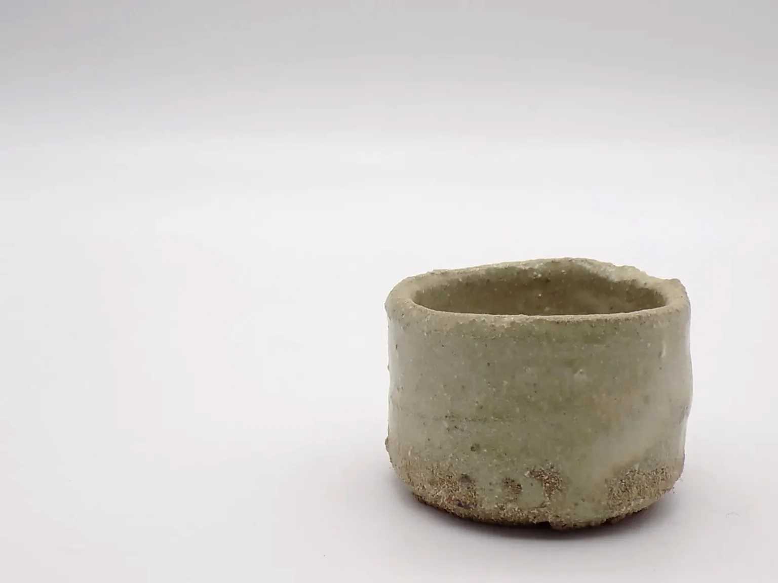 Wheel-thrown ochoko in brown and beige, side view by Timi Lantos Ceramics