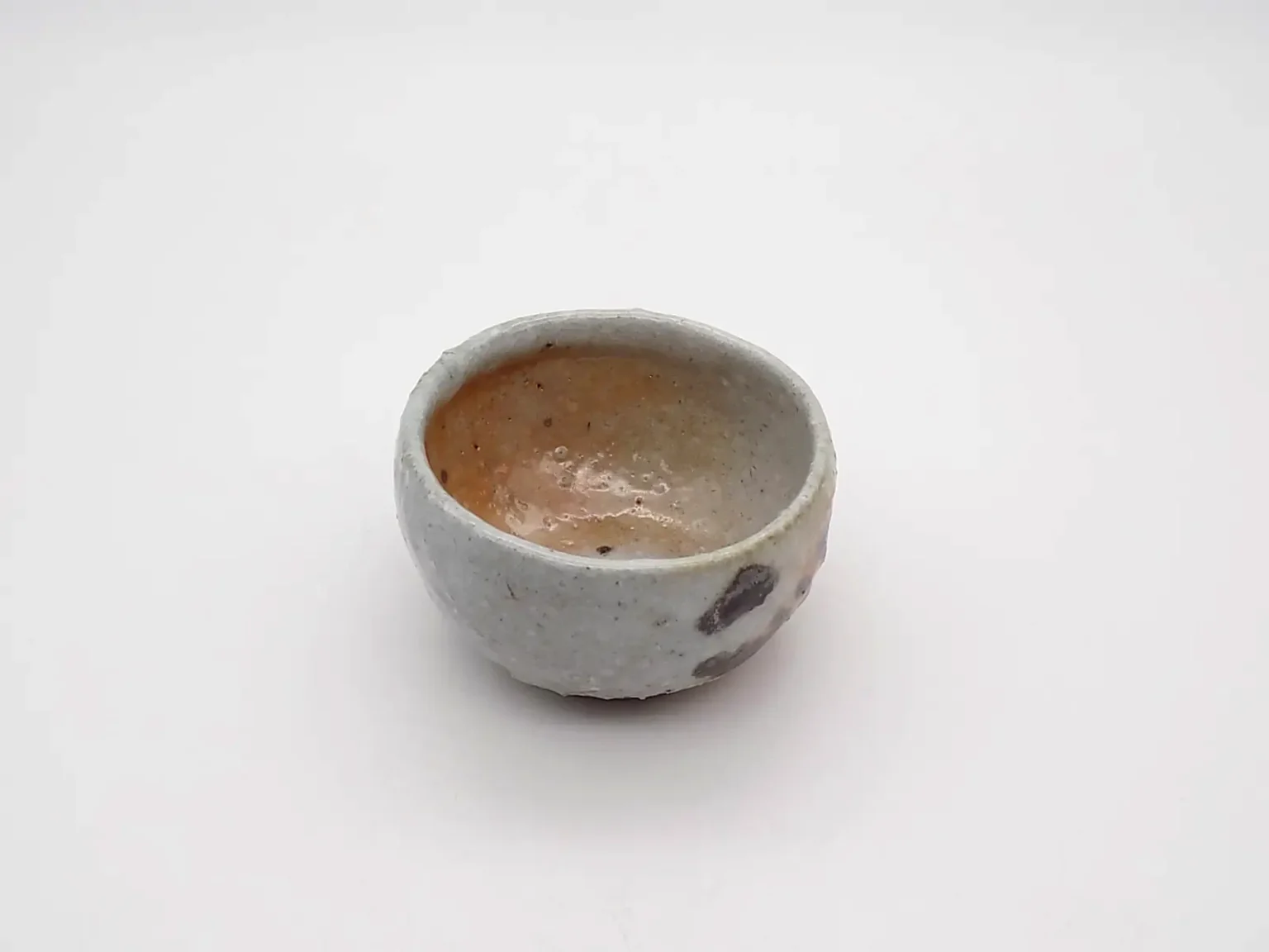 wheel thrown ochoko earthy tones top view by Timi Lantos Ceramics