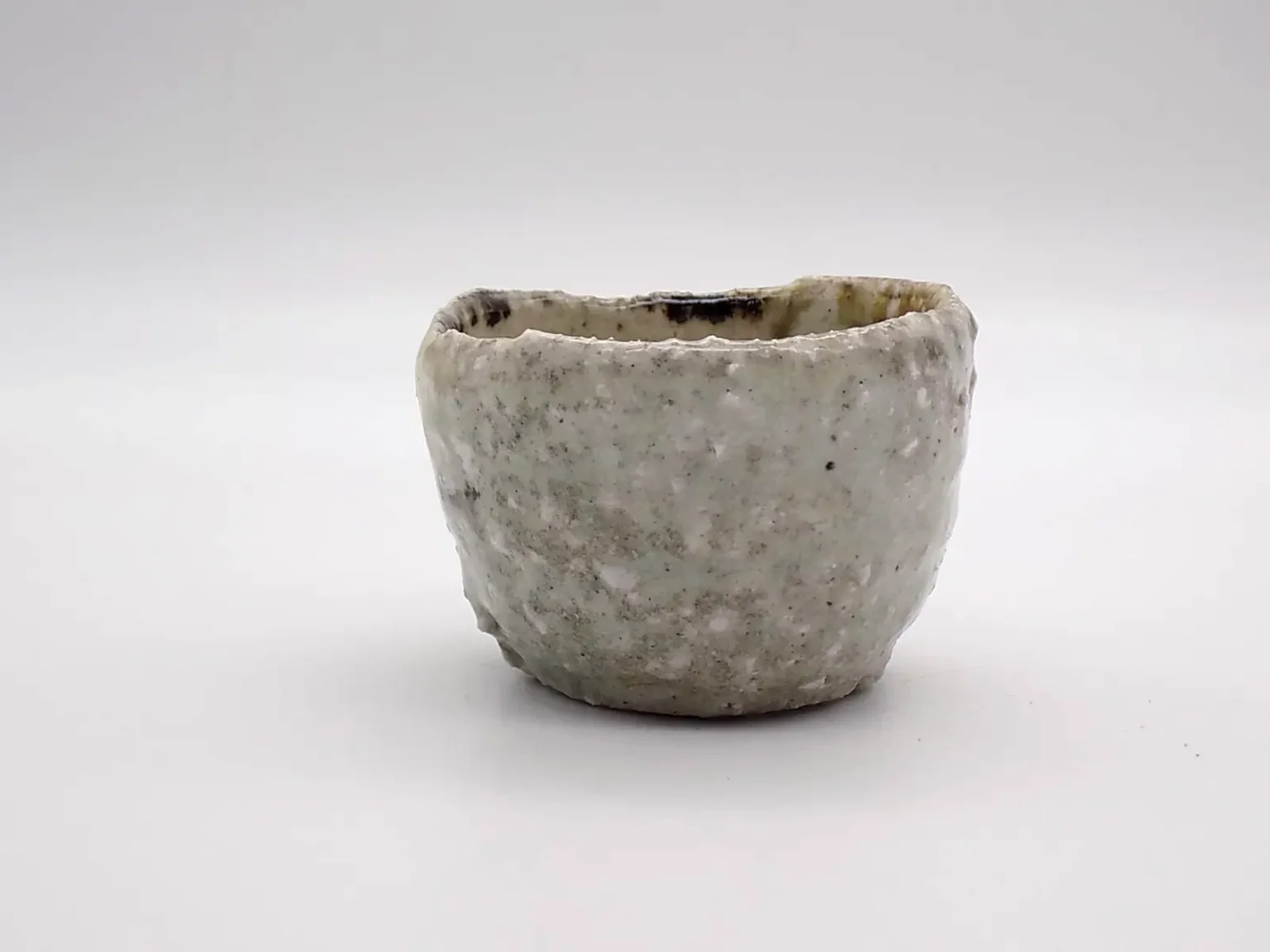 wheel thrown ochoko earthy green sake cup by Timi Lantos Ceramics