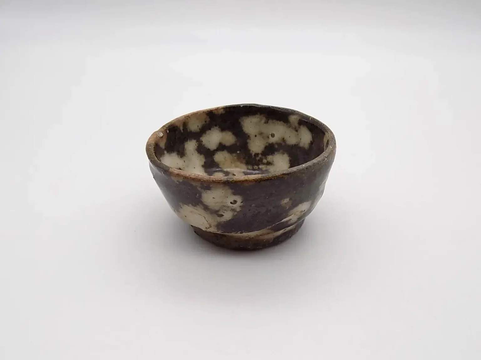 wheel thrown ochoko kohiki glaze side view by Timi Lantos Ceramics