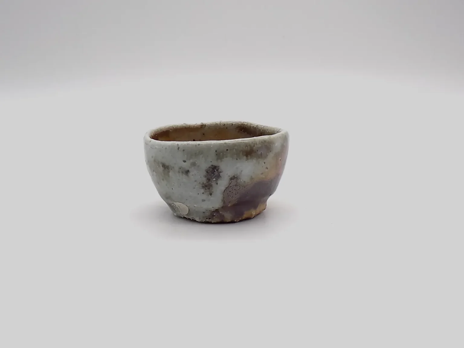 Wheel thrown ochoko wabi sabi sake cup by Timi Lantos Ceramics