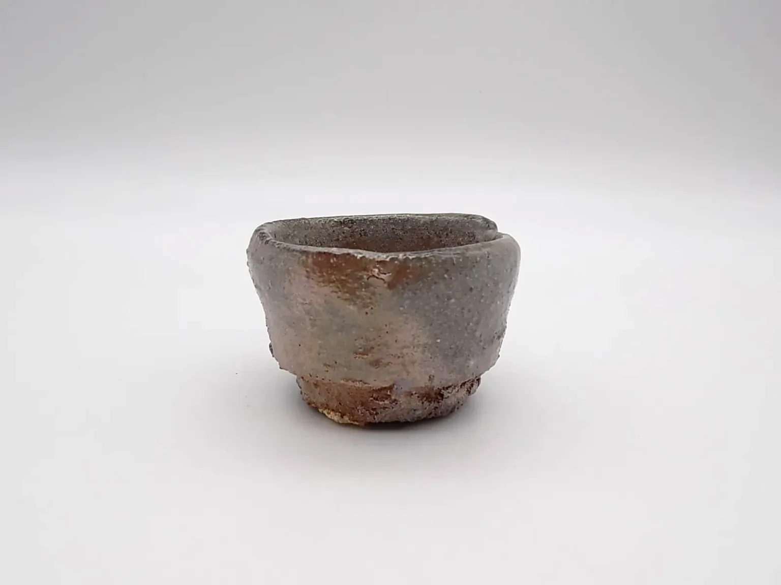 wheel thrown sake cup earthy tones side view by Timi Lantos Ceramics