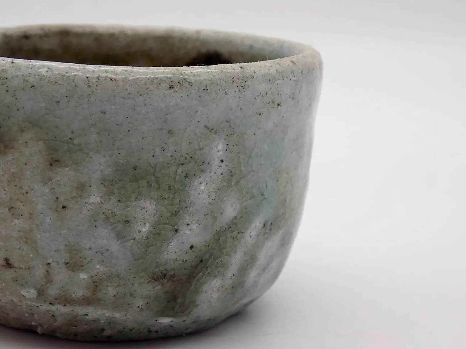 Wheel thrown sake cup with feldspar glaze detail by Timi Lantos Ceramics