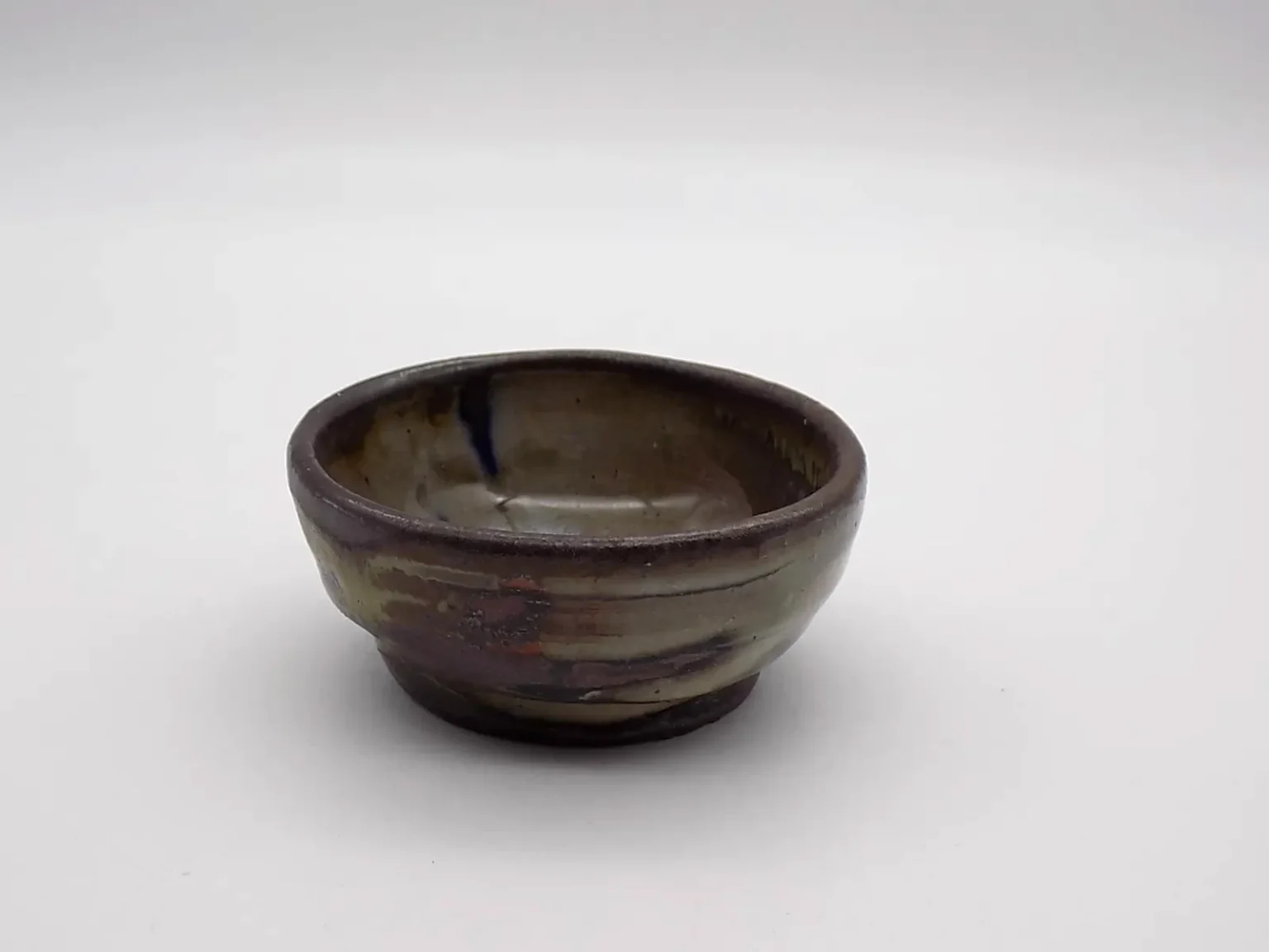 Wheel thrown sake cup with feldspar glaze by Timi Lantos Ceramics