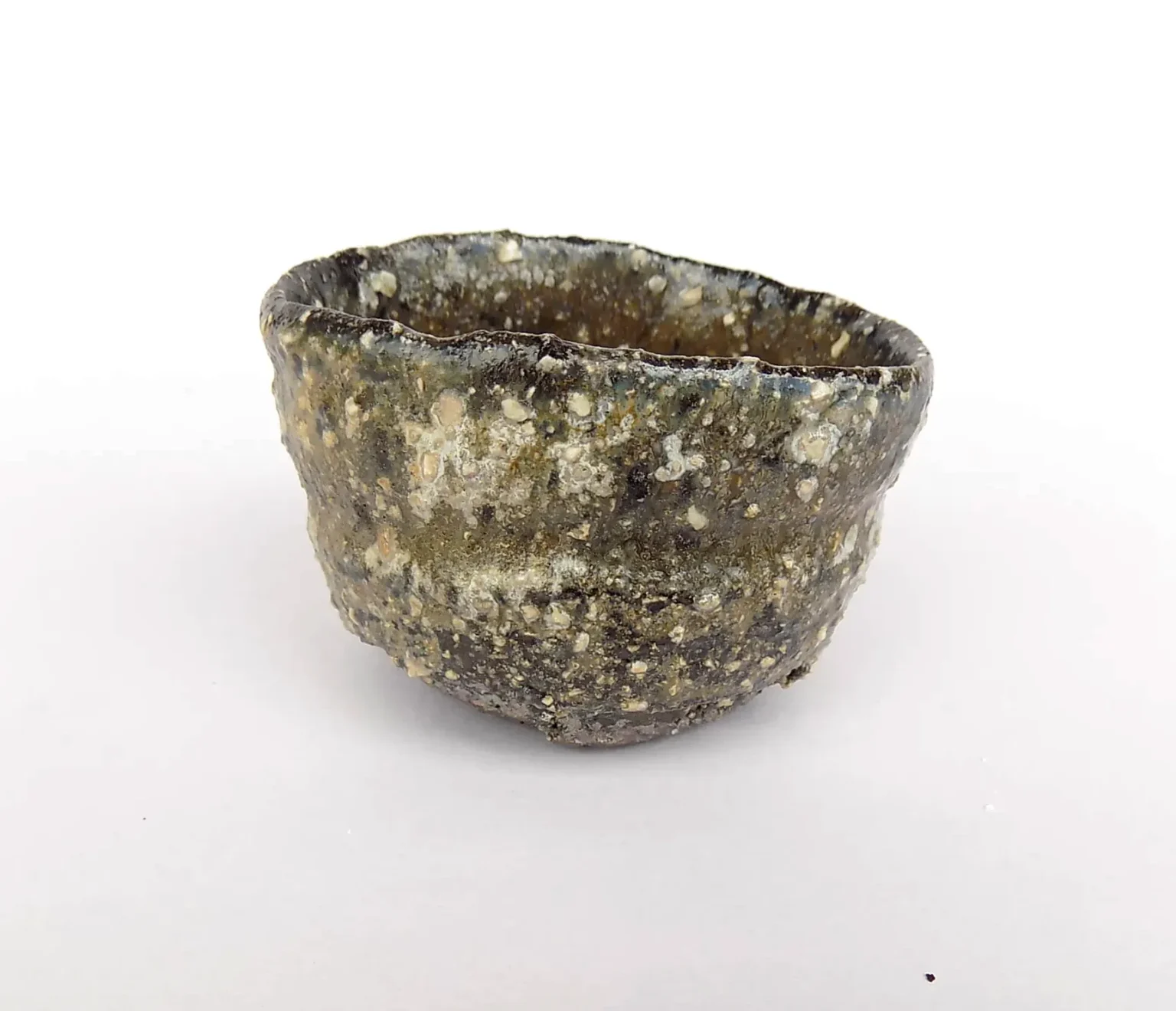 Wheel-thrown sake cup with feldspar glaze, top view by Timi Lantos Ceramics
