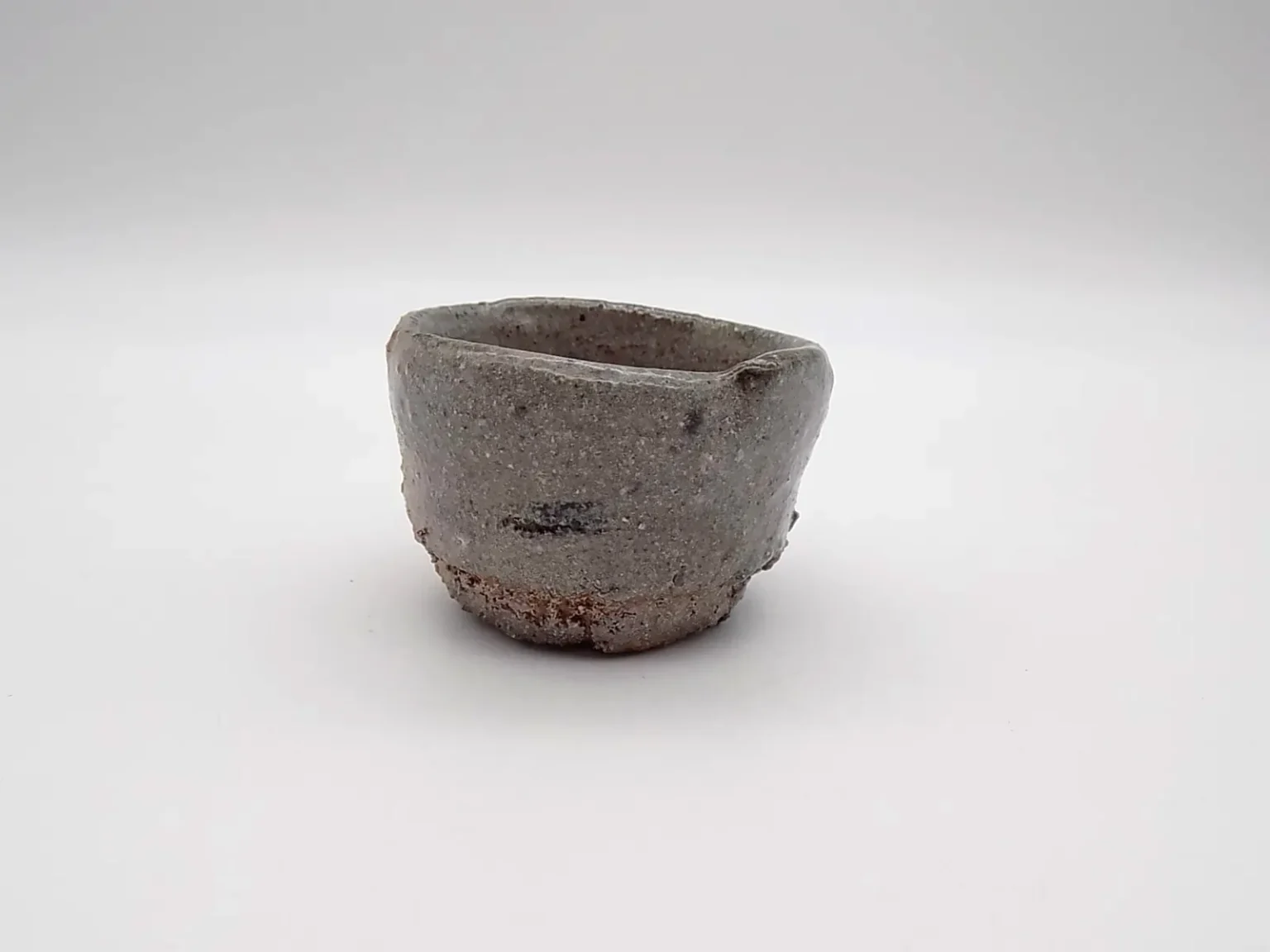 Wheel-thrown sandy red sake cup, detail by Timi Lantos Ceramics