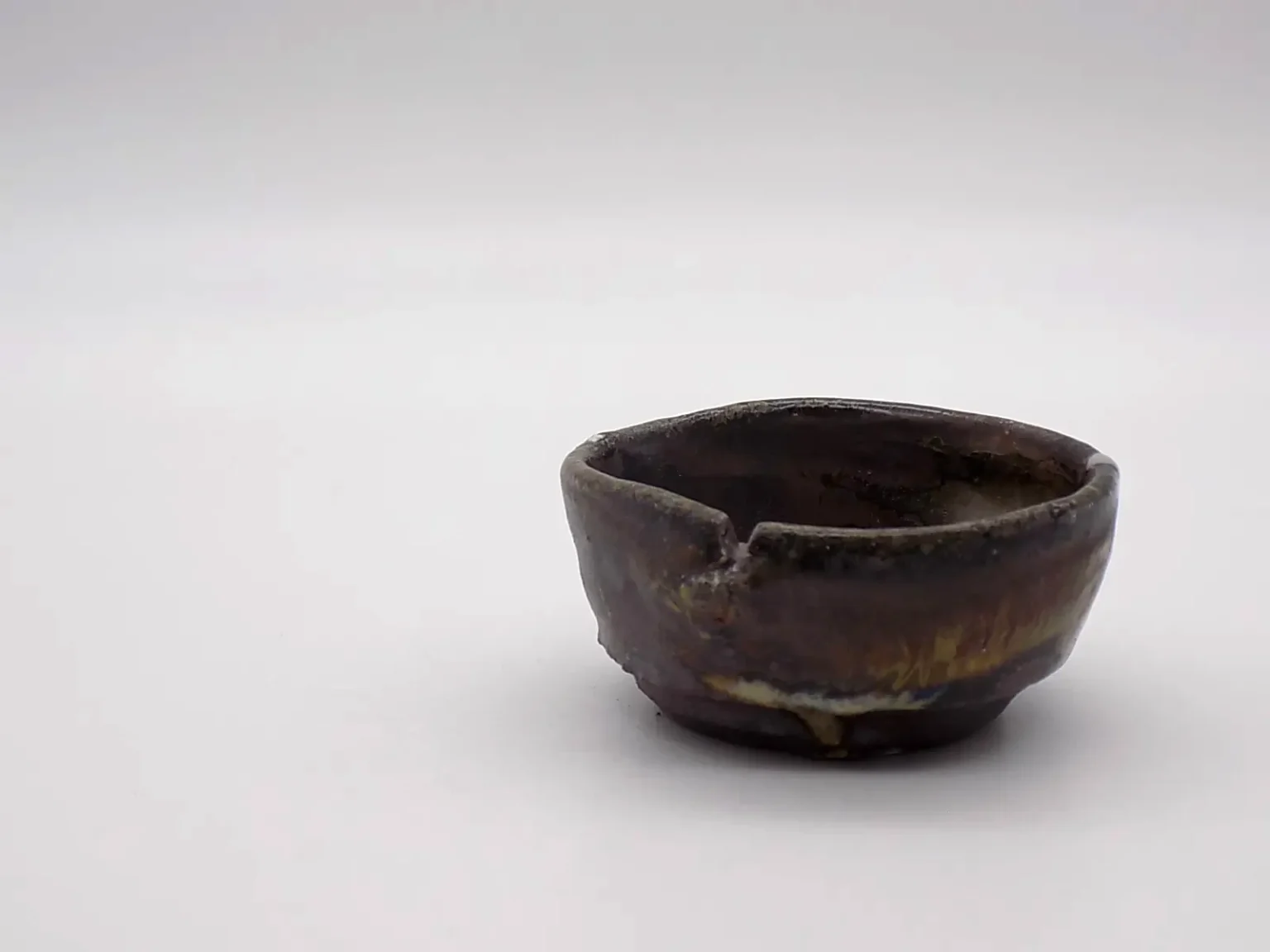 Wood-fired brown wabi-sabi ochoko, side view by Timi Lantos Ceramics