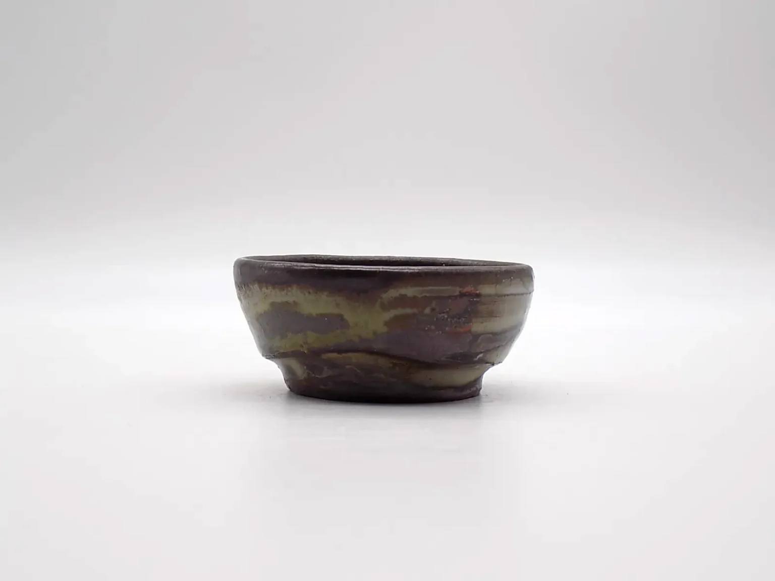 Wood-fired ochoko with earthy tones by Timi Lantos Ceramics