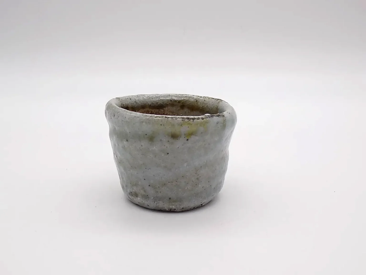 Wood-fired free-shaped ochoko, side view by Timi Lantos Ceramics