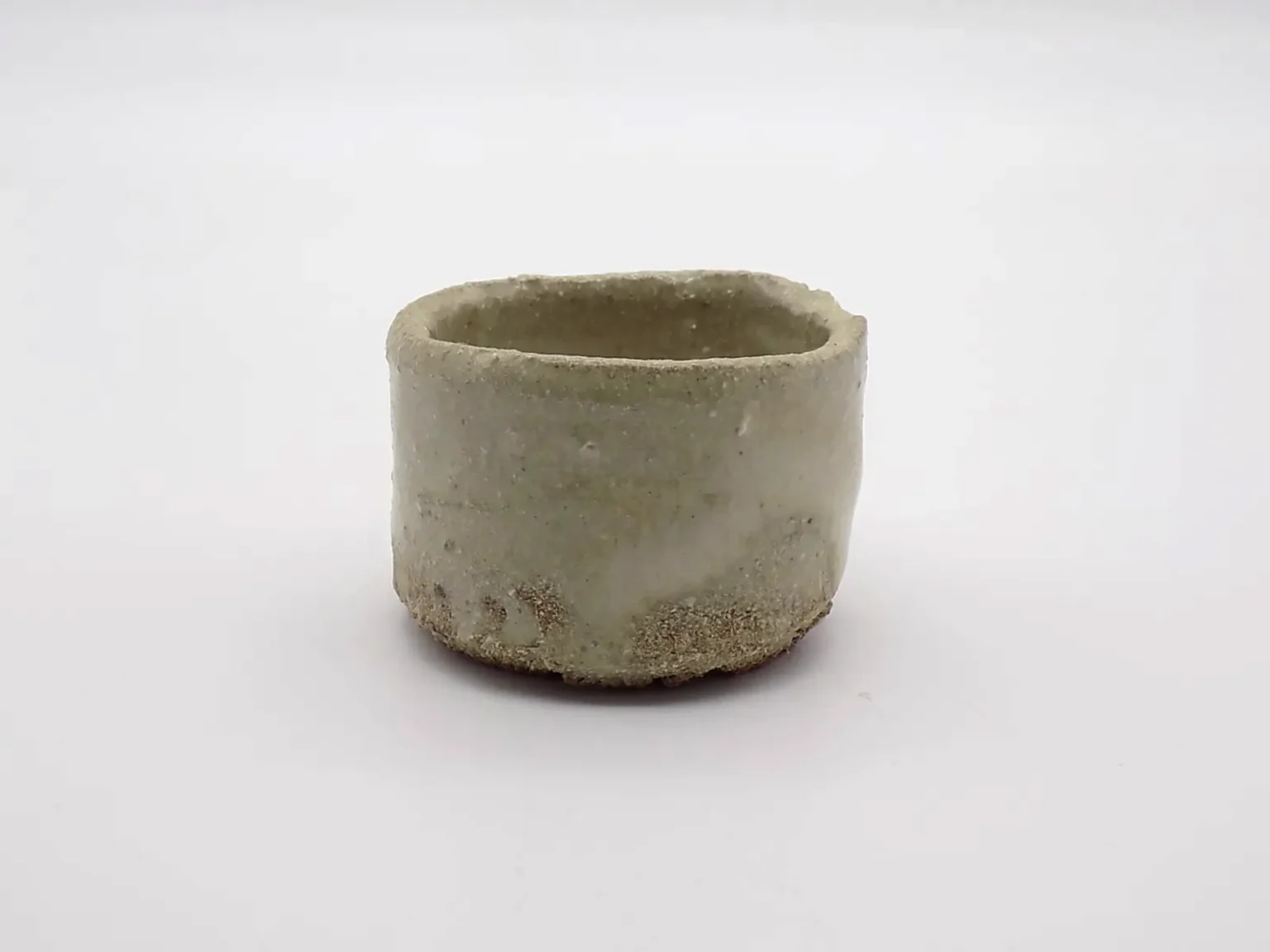 Wood-fired minimal beige ochoko, side view by Timi Lantos Ceramics