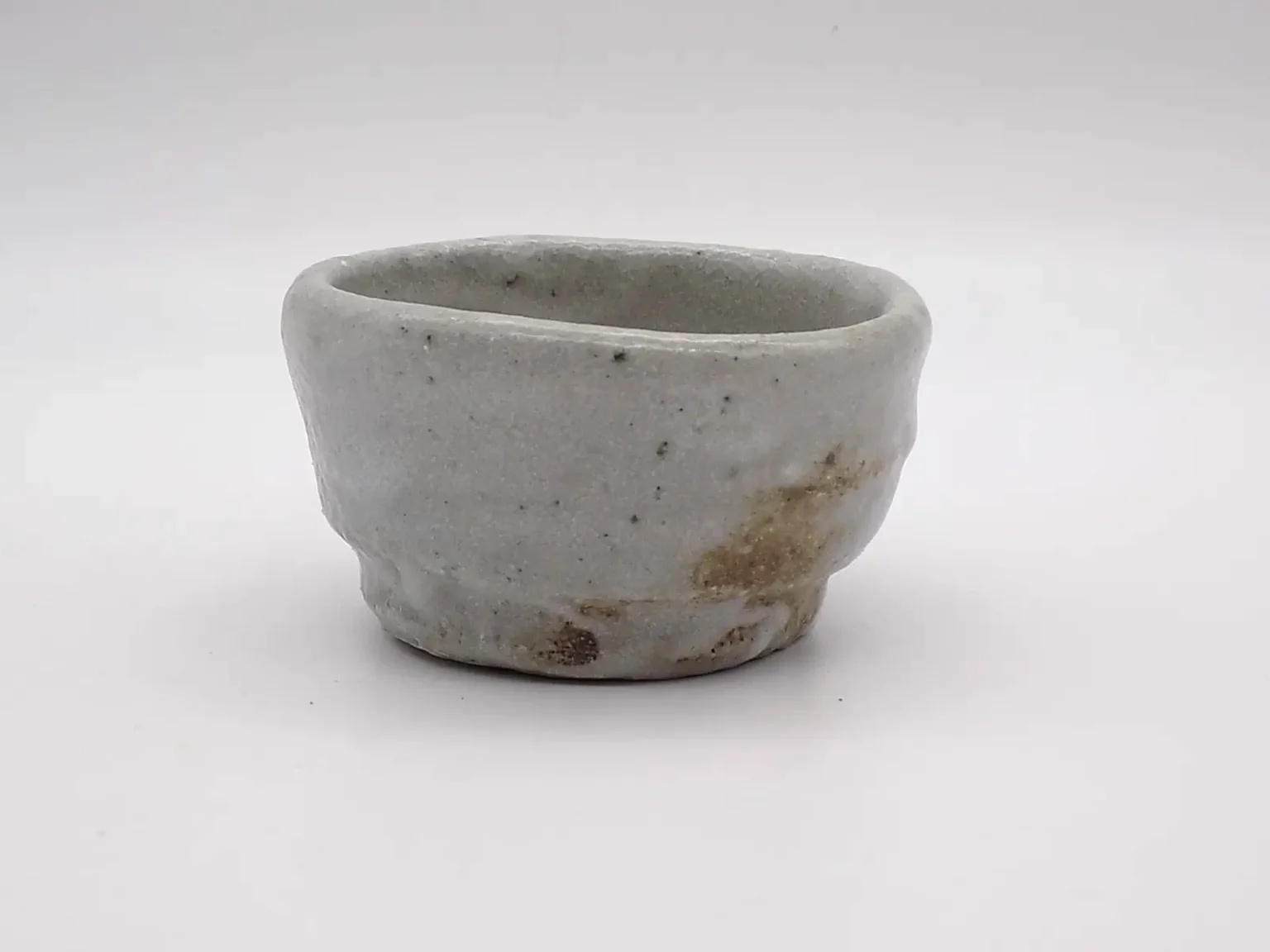 wood fired ochoko minimal white sake cup by Timi Lantos Ceramics